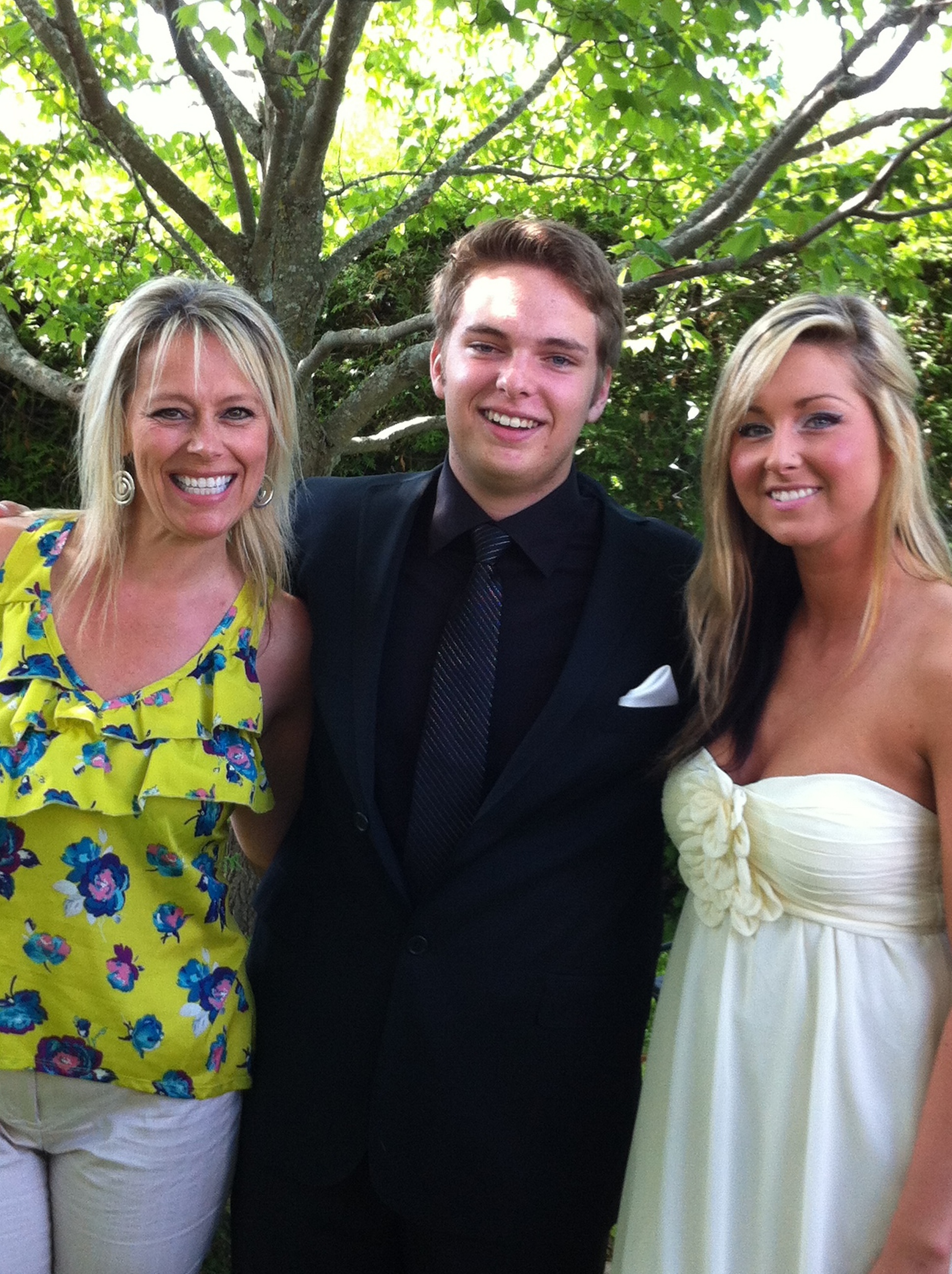 This is Angie, Austin and Lindsay. The photo was taken at a pre-prom garden party on the occasion of Austin's high school graduation in June 2012.